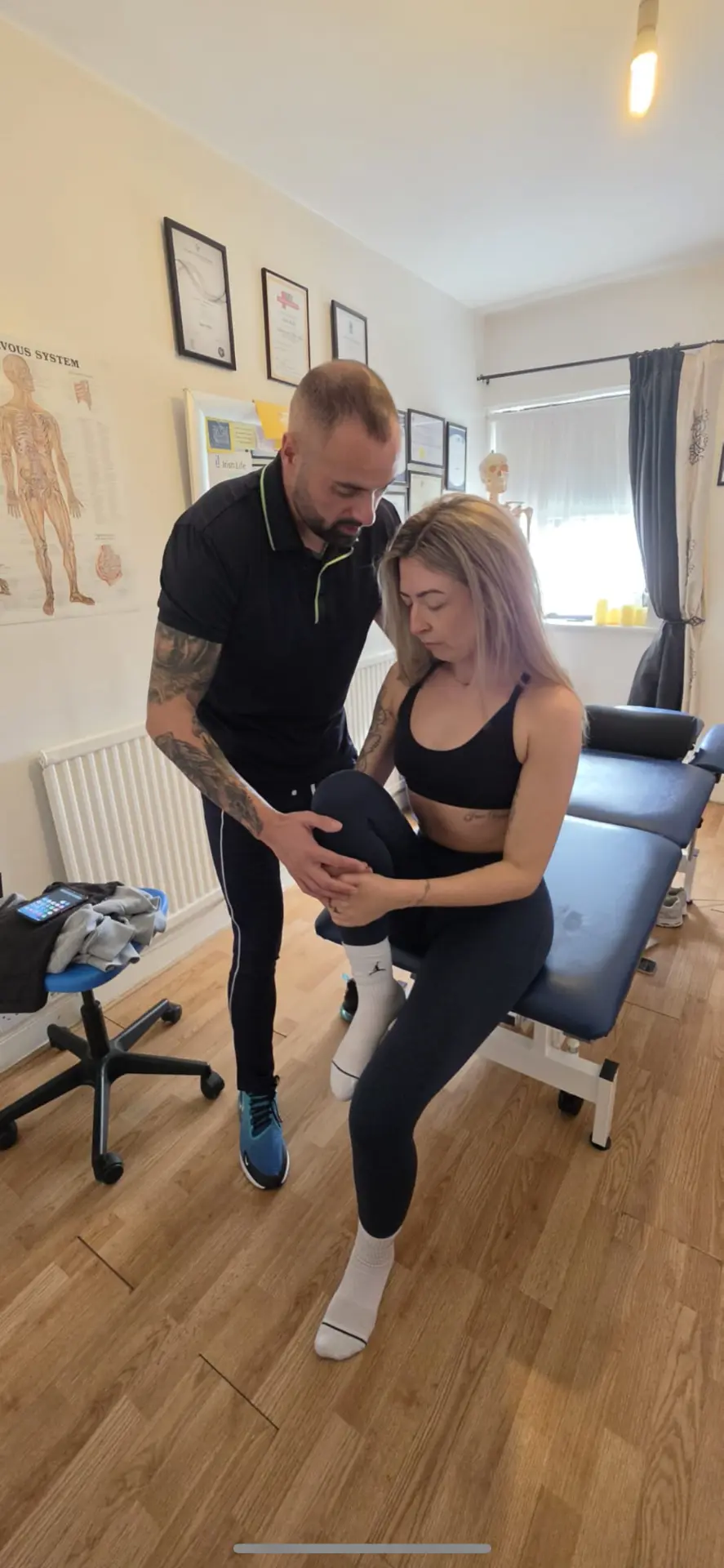 Sean Kelly assessing a client's knee at the Better Life Ireland clinic